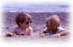 Kids playing in the sand at the beach