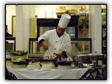 Chef Kel creating a meal in the Sunset Cafe kitchen