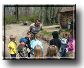 staff with kids outside at TREC