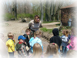 Presque Isle ranger answers questions of young people during walk at TREC